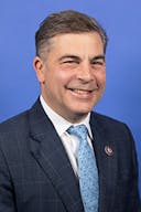 Official profile photo of Rep. Mike Carey