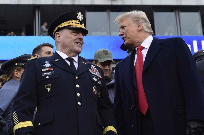 Chairman of the Joint Chiefs of Staff, Mark Milley, standing next to former President Donald Trump